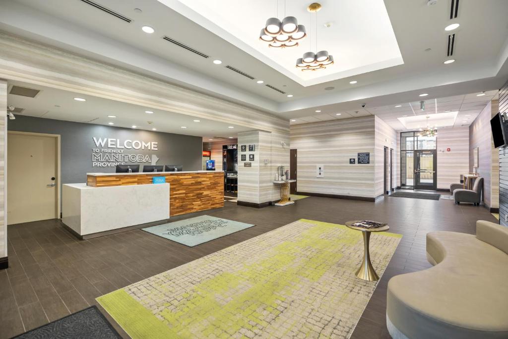 a lobby of a hotel with a welcome reception at Hampton Inn by Hilton Winnipeg in Winnipeg