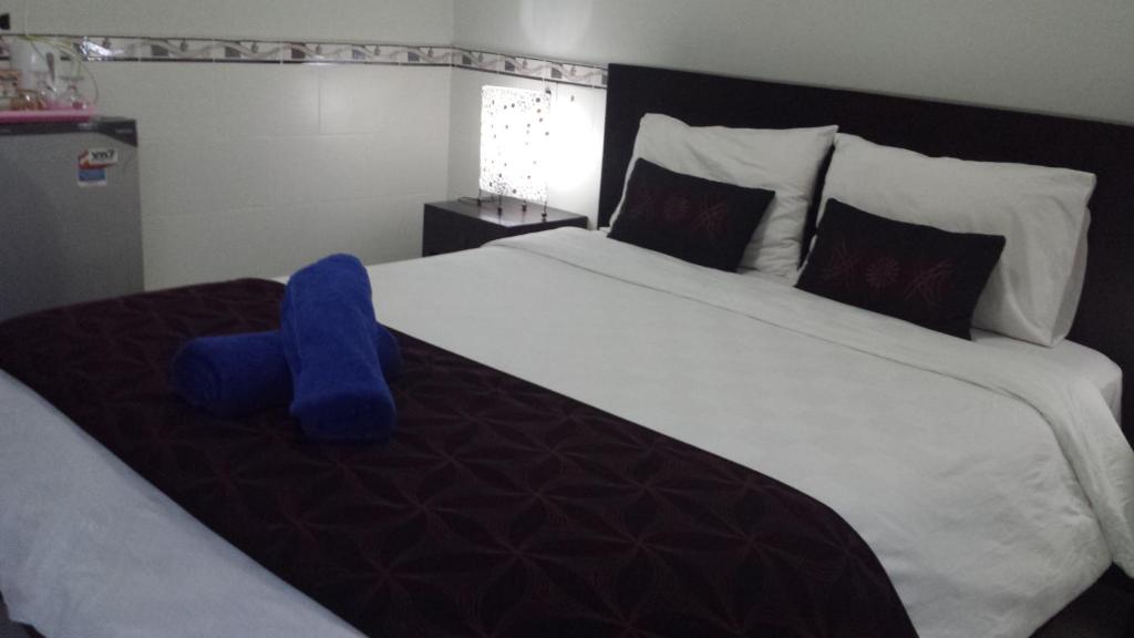 Postel nebo postele na pokoji v ubytování Jepun Segara Guest House