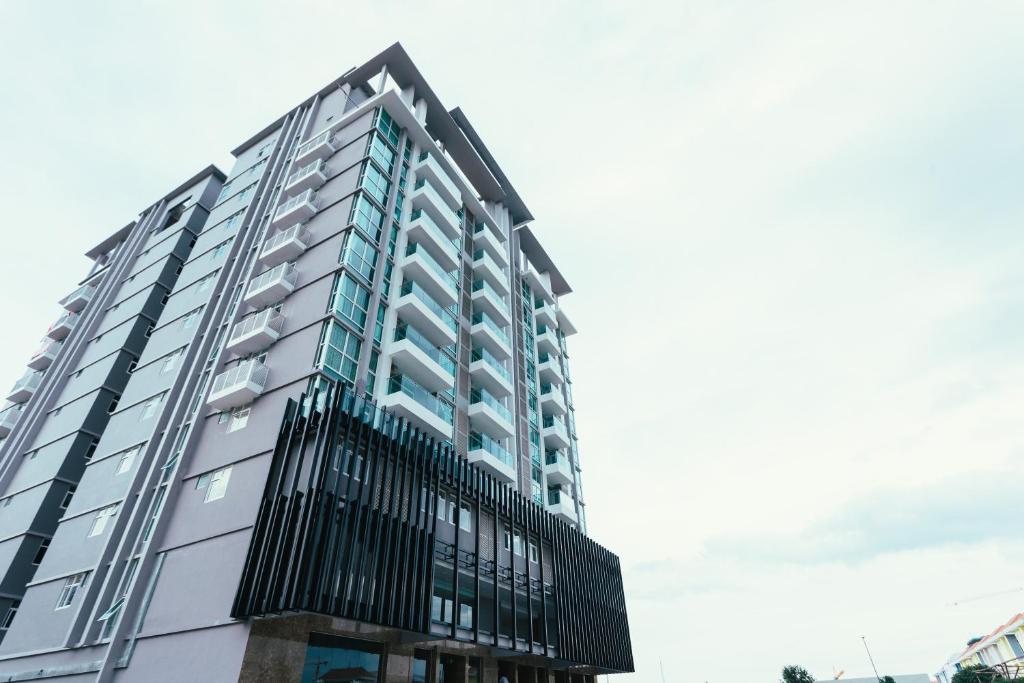 a tall building with a lot of windows at CA&SA Serviced Apartment in Phnom Penh