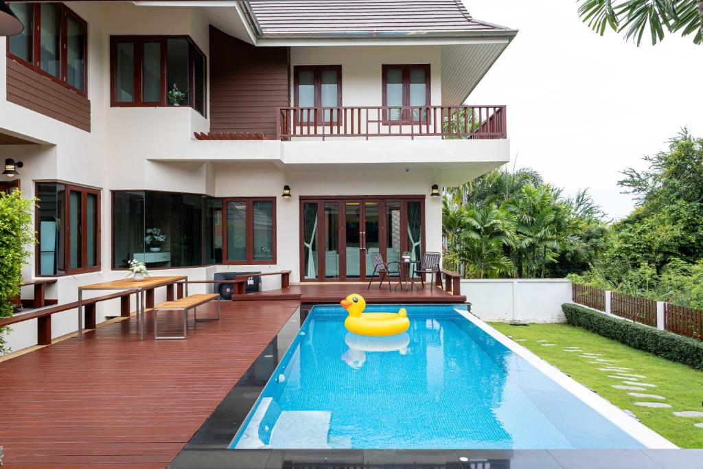 a house with a rubber duck in the swimming pool at Premium Villa Baan Kinlom Chomlay in Hua Hin