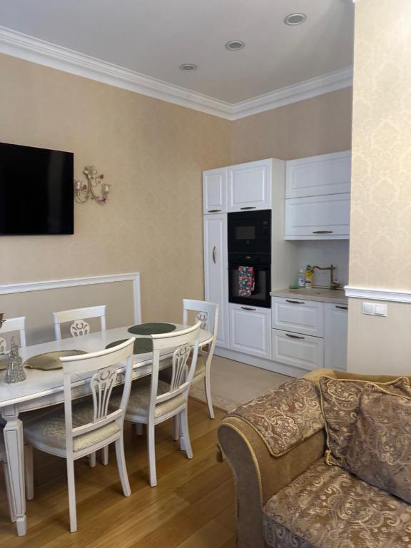 a living room with a table and a couch at classic in Daugavpils