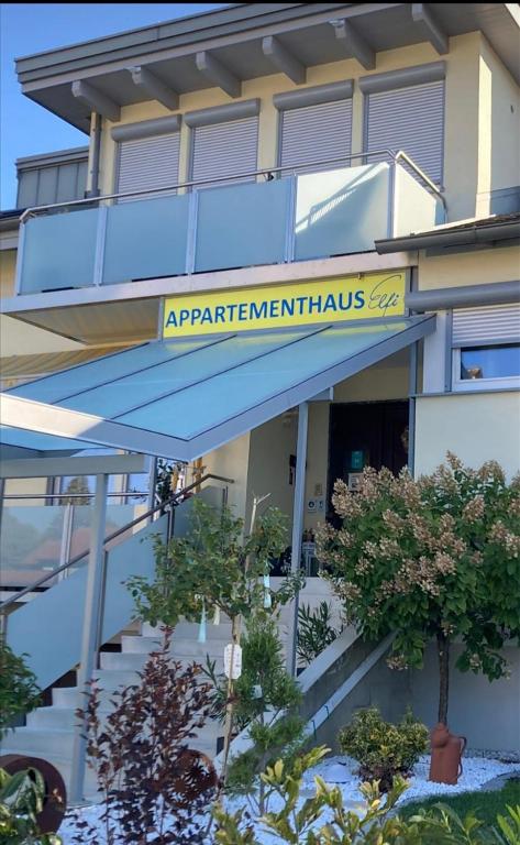 a building with a sign that reads apartment at Appartementhaus Elfi in Barnbach