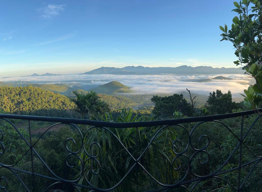 a view from the top of a hill with clouds at Villa Nugaliyadda in Kandy