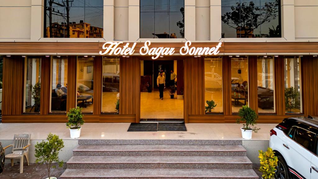 a building with a sign that reads hold open camera control at Hotel Sagar Sonnet in Haldia