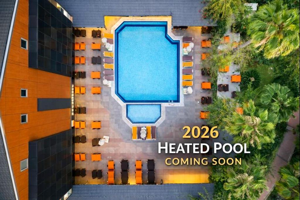 an image of a heated pool in a hotel at Fame Beach Hotel in Kemer