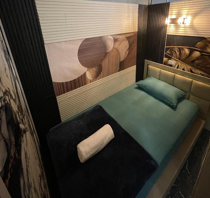 a room with a bed with a paper roll on it at Dream Moon Hostel in Haad Rin