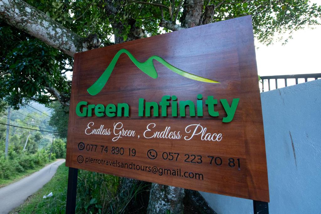 a sign for a green institution on a road at Green Infinity Resorts in Diyatalawa