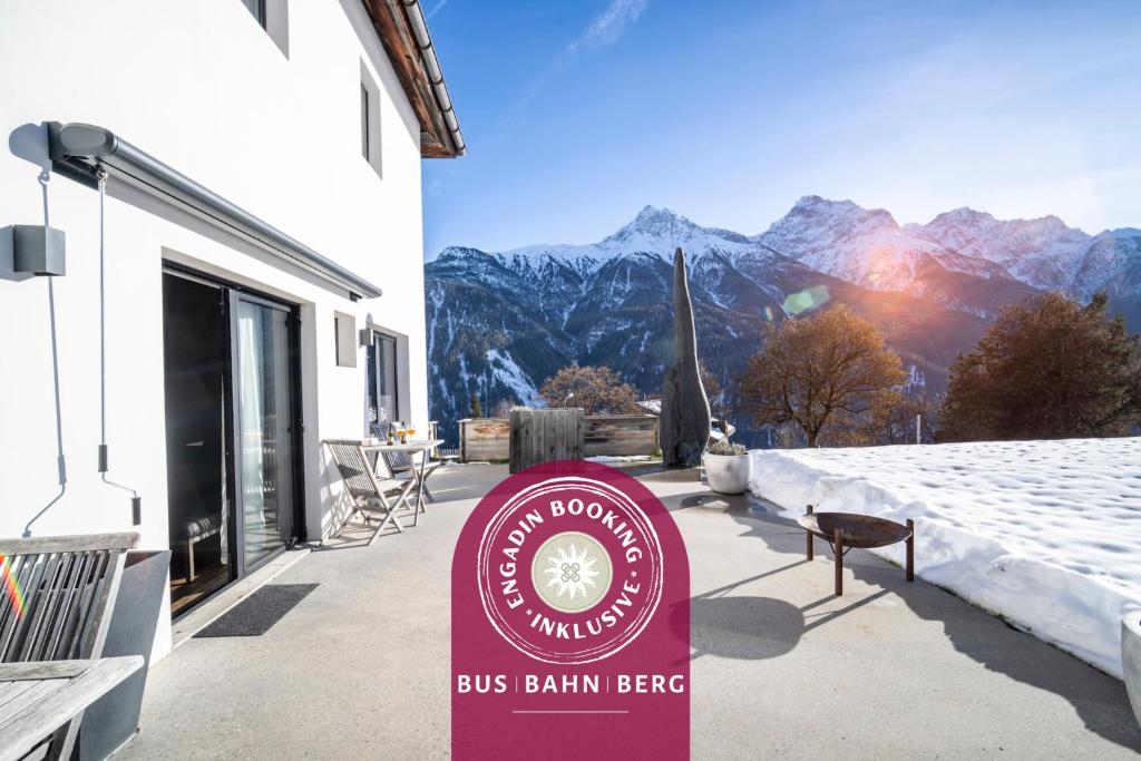 a bus bahn beef sign in front of a building at Chasa Vital in Sent