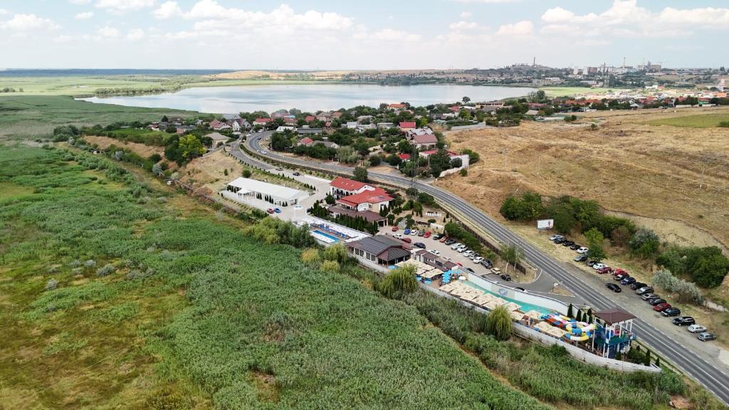 an aerial view of a town next to a lake at Pensiunea Lebada in Tulcea