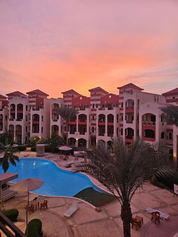 a view of the resort at sunset at Ground floor Garden & Pool & Beach Studio in Sharm El Sheikh