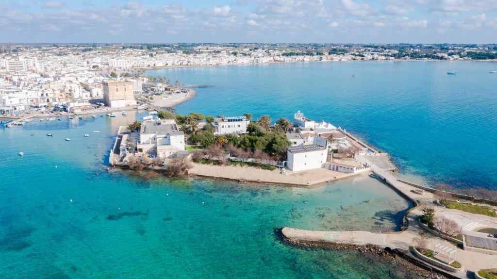 an aerial view of a small island in the water at Hotel Lo Scoglio in Porto Cesareo