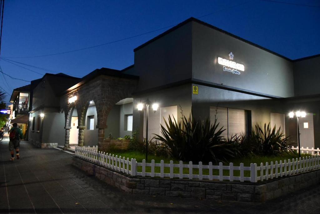 a building with a sign on it at night at Hotel Hijos Del Mar - Rincón Costero in Miramar