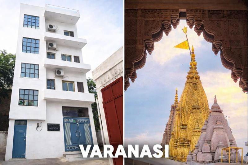 a building and a tower with a yellow flag on it at Banaras Apartment Homestay 7BHK AC & NON AC ROOMS in KASHI VISHWANATH JYOTIRLING in Varanasi