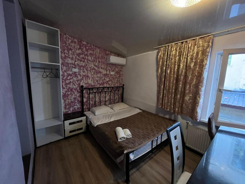 Llit o llits en una habitació de Studio Bucuresti-Centru