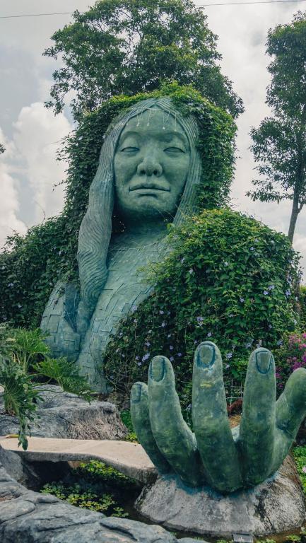 a statue of a woman covered in plants at Kindia Park Hotel in La Esmeralda