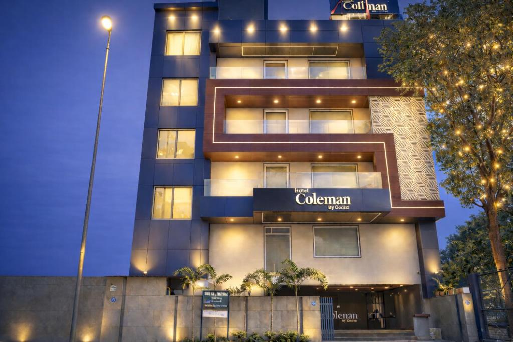 a building with a sign that reads colombinian at Qotel Signature Coleman Janakpuri Near District Centre & Pacific Mall in New Delhi