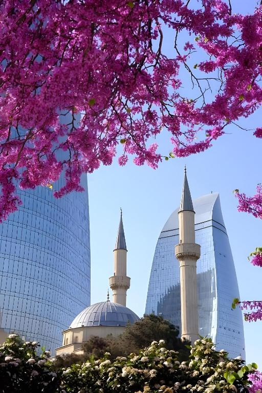 a view of two mosques and a tree with pink flowers at FRIENDS Hostel Baku in Baku