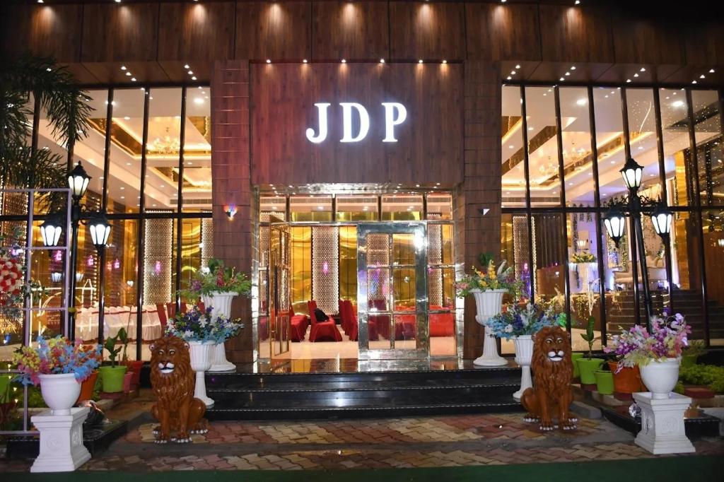 a store front with a jdp sign on it at Virat Palace in Deoghar