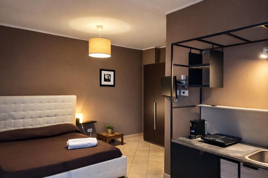 a bedroom with a bed and a sink in it at MyBed B&B in Cavallino di Lecce