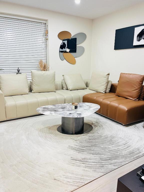 a living room with a couch and a coffee table at Haven Stays - D15A5DF in Tyrrelstown