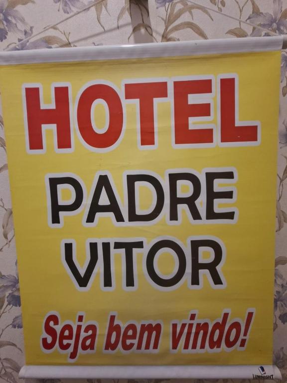 a sign for a hotel patio vipper on a wall at Hotel Padre Vitor in Aparecida