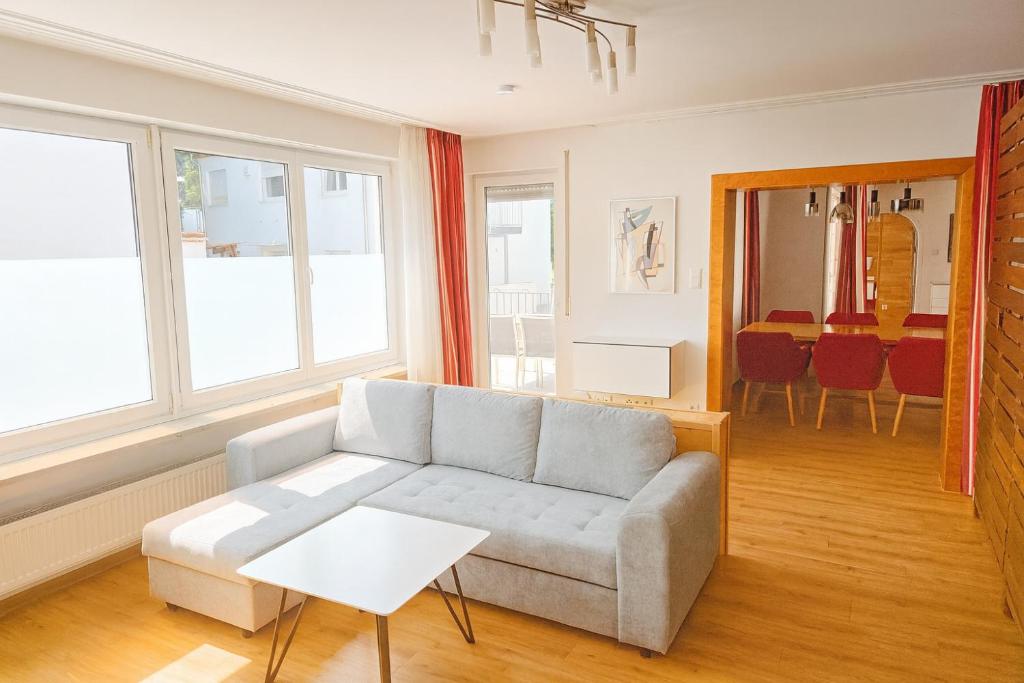 a living room with a couch and a table at Villa Viktoria 3 - Apartments in Ingolstadt