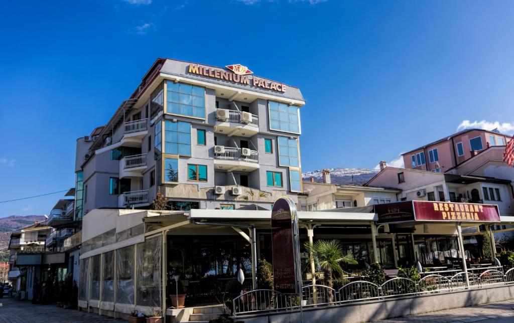 a building with a restaurant on the side of it at Millenium Palace in Ohrid