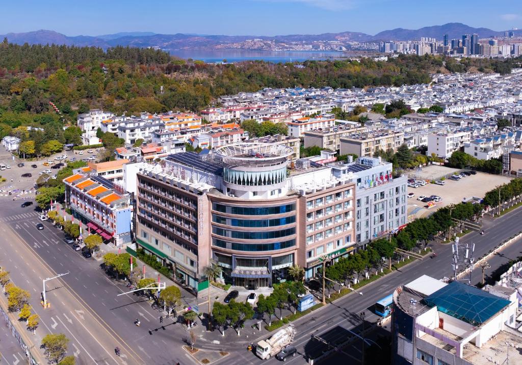 an aerial view of a building in a city at Orange Crystal Hotel Dali Erhai Park in Dali