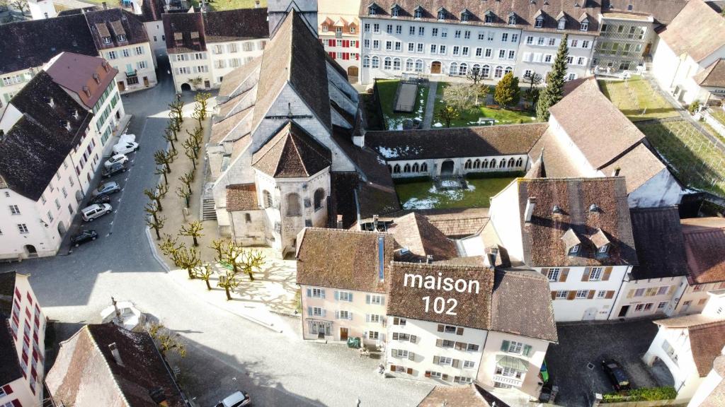 an aerial view of a town with a church at maison102 studio Saint-Ursanne Jura in Saint-Ursanne