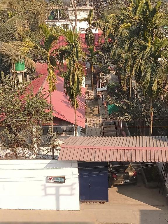 an overhead view of a building with palm trees at Pushpa Nilayam in Khaprail