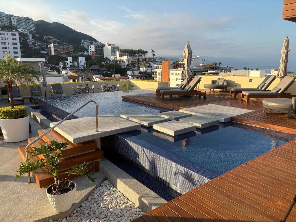 a swimming pool on the roof of a building at Pavilion 307 in Puerto Vallarta