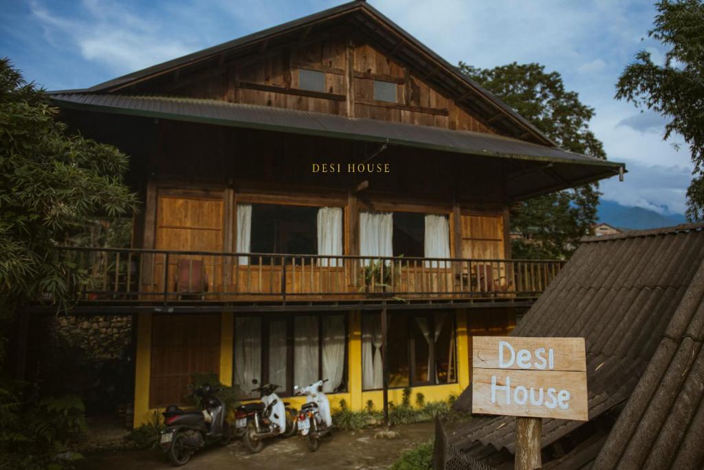 a guest house with motorcycles parked in front of it at Sapa Ta Van Desi House - Mountain View & Hiking Tours in Sapa