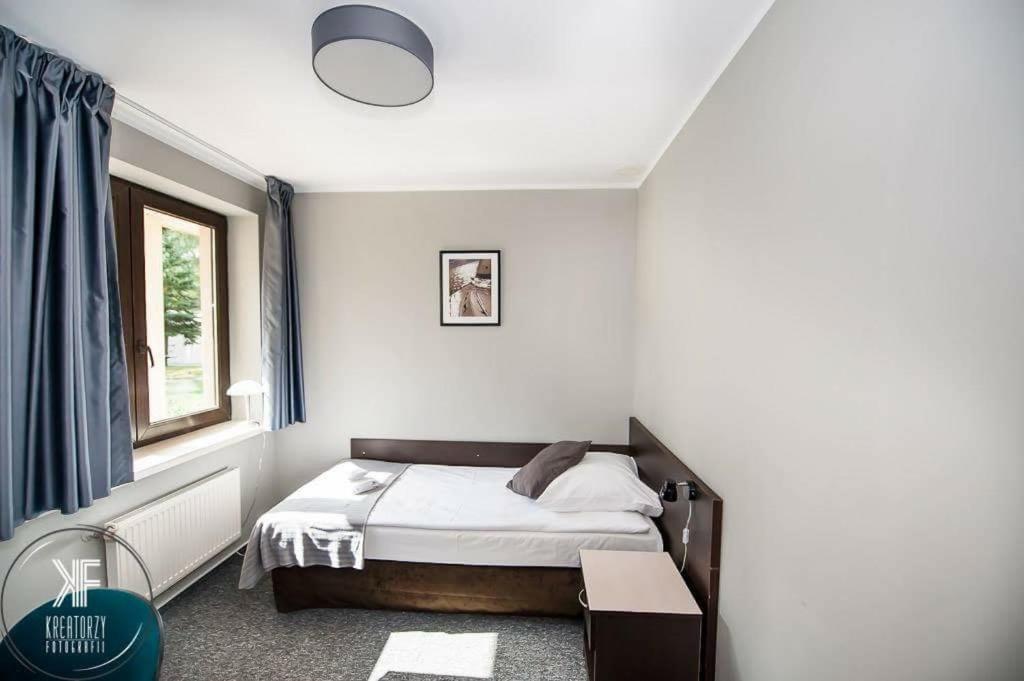 Posteľ alebo postele v izbe v ubytovaní Hotel Otomin