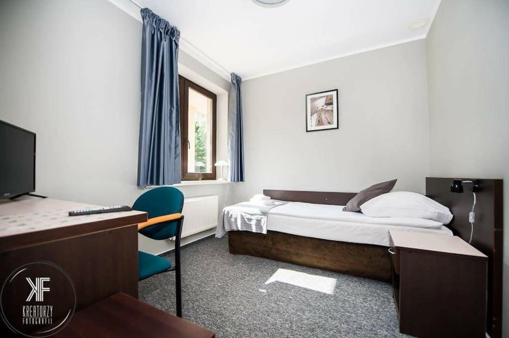 Televízia a/alebo spoločenská miestnosť v ubytovaní Hotel Otomin