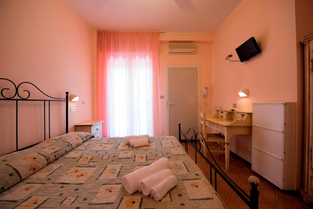 Postel nebo postele na pokoji v ubytování Hotel Settebello B&B