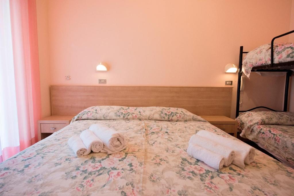 Postel nebo postele na pokoji v ubytování Hotel Settebello B&B