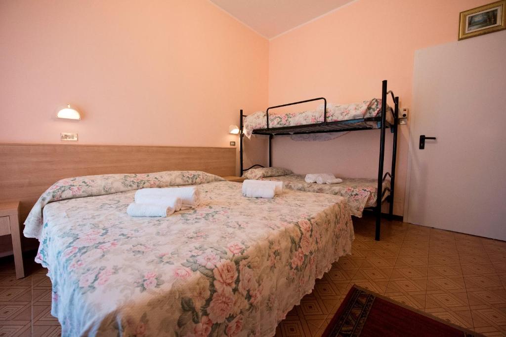 Postel nebo postele na pokoji v ubytování Hotel Settebello B&B