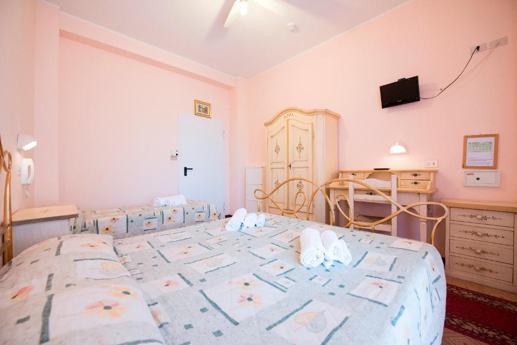 Postel nebo postele na pokoji v ubytování Hotel Settebello B&B