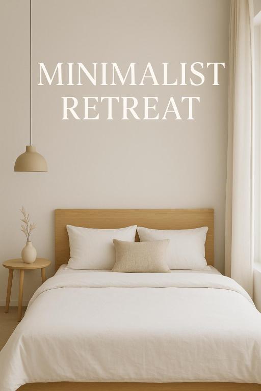 a bedroom with a bed with a mindfulness retreat sign on the wall at Minimalist Retreat in Minglanilla