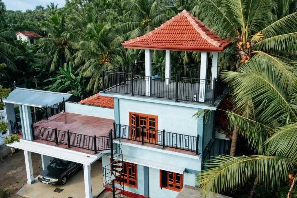 an aerial view of a house with a red roof at Sai Guest House in Chavakachcheri