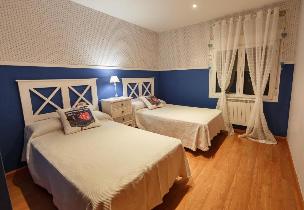 Postel nebo postele na pokoji v ubytování Casa Rural La Piedra De Juana