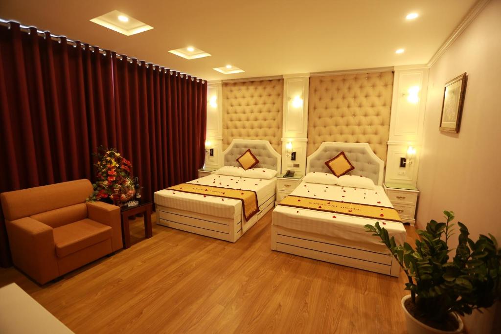 Postel nebo postele na pokoji v ubytování Kawasaki Hotel Cầu Giấy
