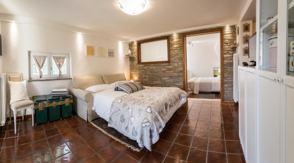 Postel nebo postele na pokoji v ubytování Assisi Charme