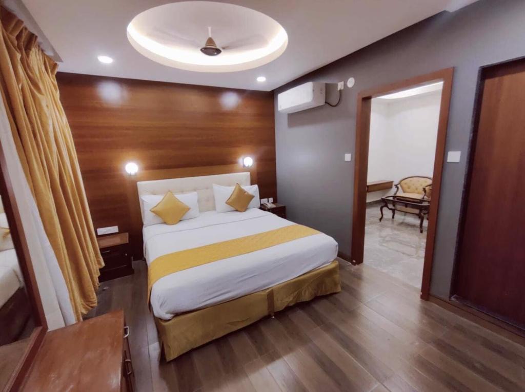 a bedroom with a large bed in a room at Hotel La Hotera in Hyderabad