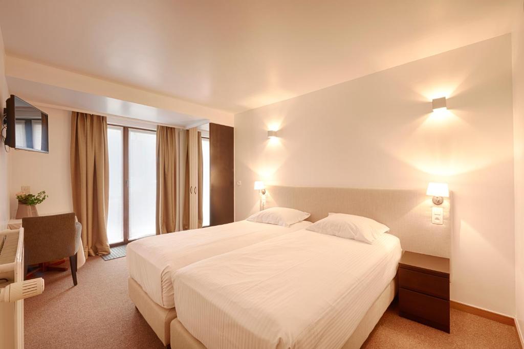 Postel nebo postele na pokoji v ubytování Hotel 't Putje