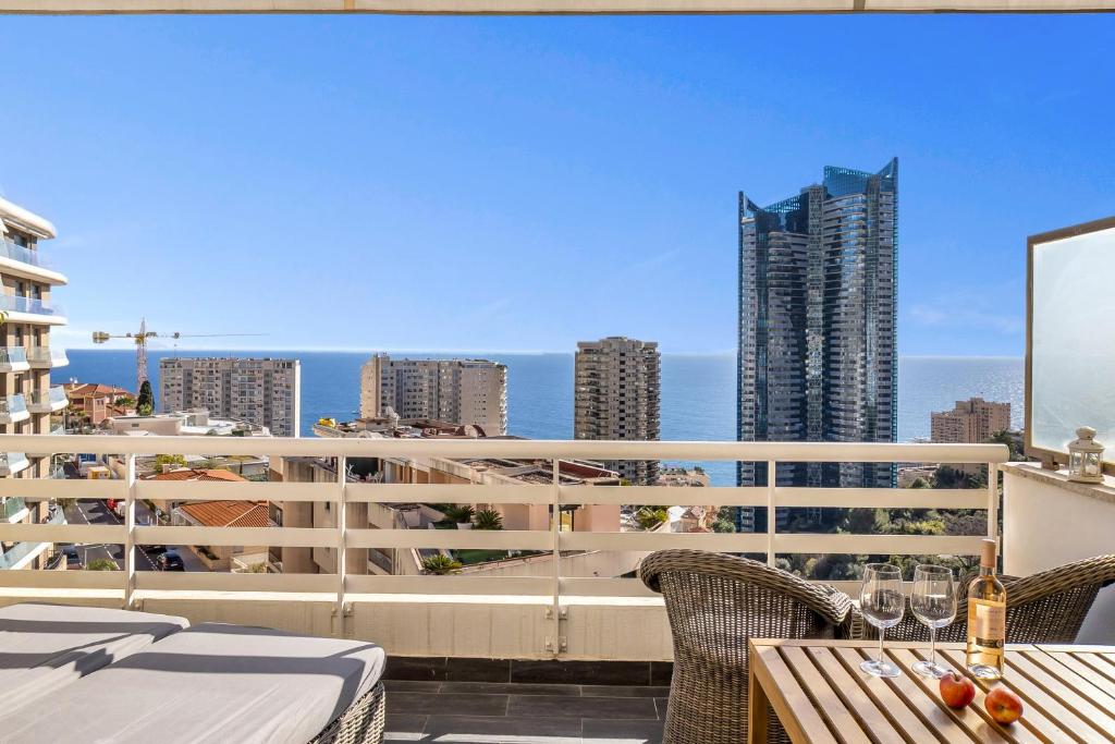 a balcony with a view of the city at Beausoleil near Monaco - Cosy Studio with Sea view in Beausoleil