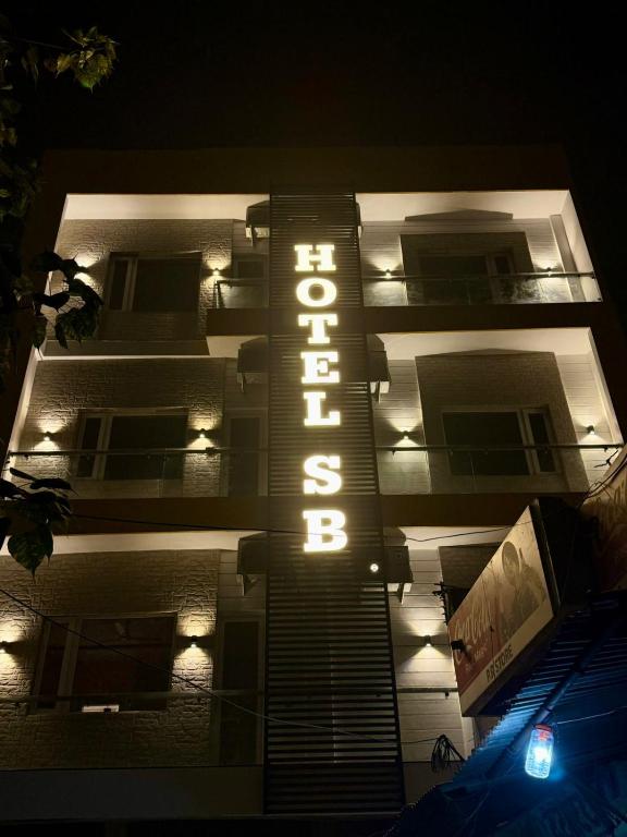 a building with a hotel sign lit up at night at Hotel Silver Bricks in Amritsar