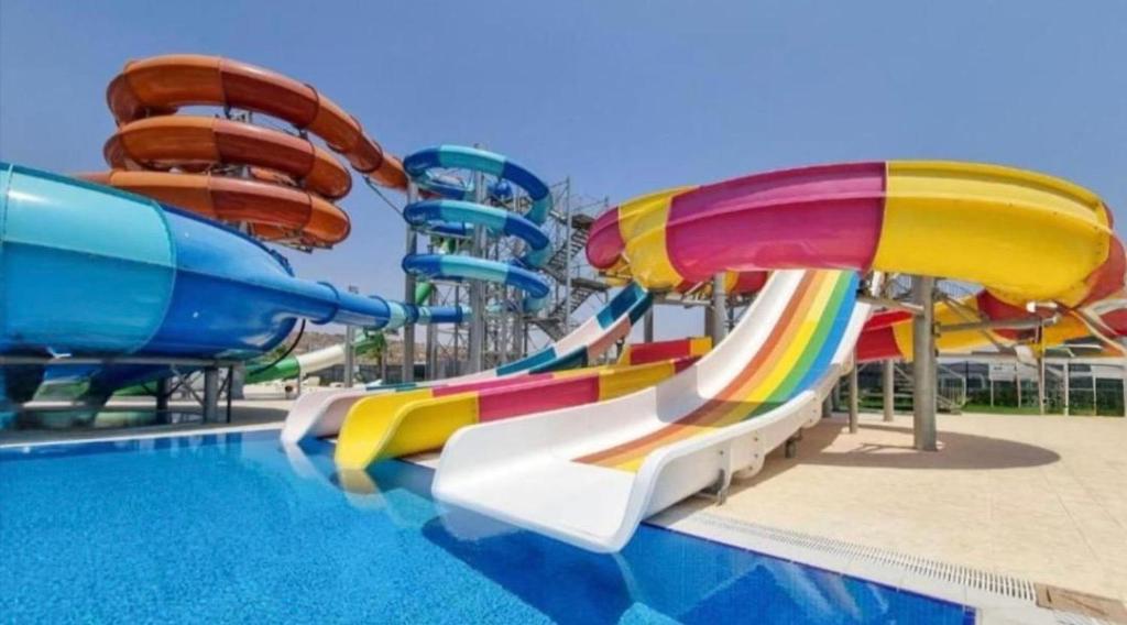 a water park with a colorful water slide at Helena Resort & Spa in Kalecik