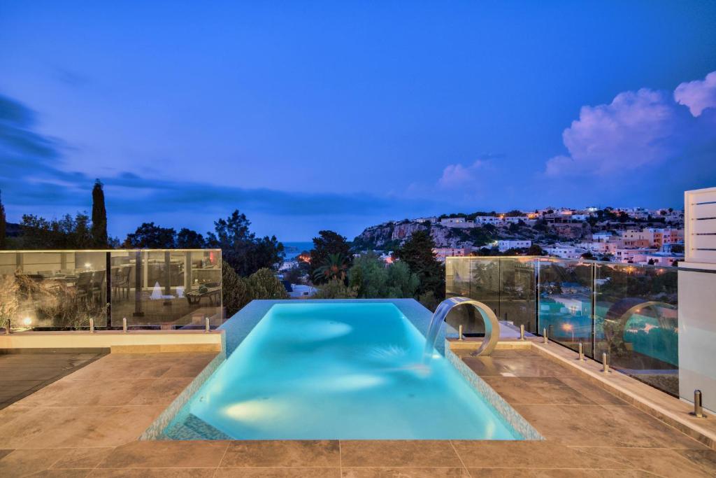 a swimming pool on the roof of a house at Villa Gaia - Sunset Views, Indoor Heated Pool, Sauna and Games Room in Mellieħa