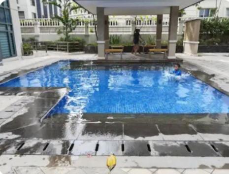 a swimming pool with blue water in a building at The Layover Condotel ,Palm Tree two Villas ,cluster 2 - unit 7q , New Port Boulevard , Newport City ,NAIA Terminal 3 , Pasay City , Philippines in Sampong
